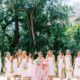 This bride stunned with a pink dress at her playful, romantic beachside wedding